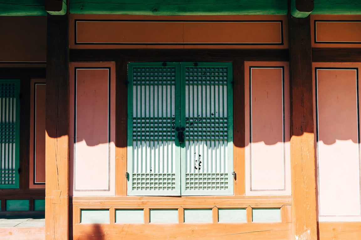 Front Of A House With Green Wooden Window 